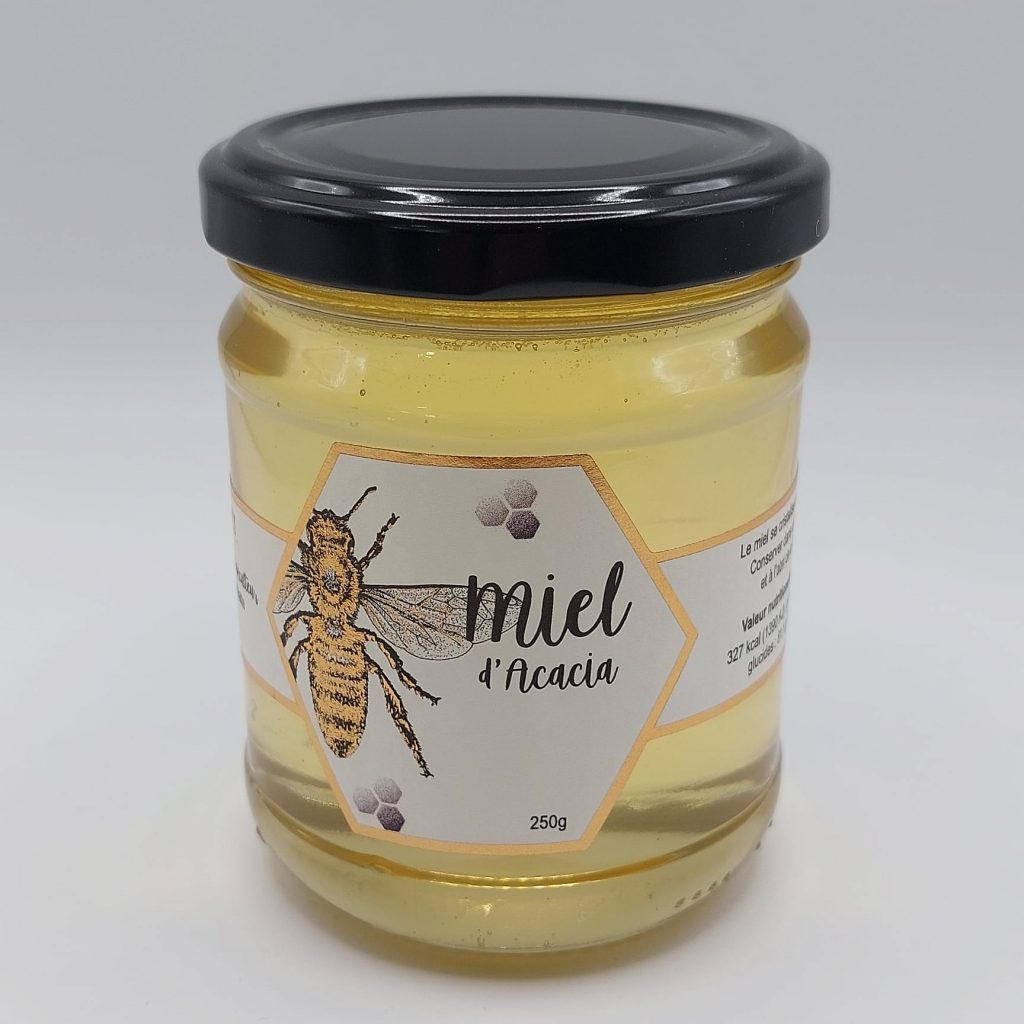 Pot de miel d’acacia au goût doux et aux notes florales légères.