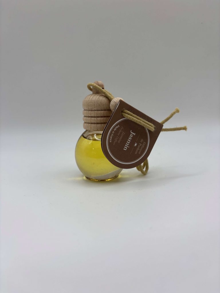Diffuseur de parfum en forme de boule avec senteur jasmin, ambiance florale et raffinée.