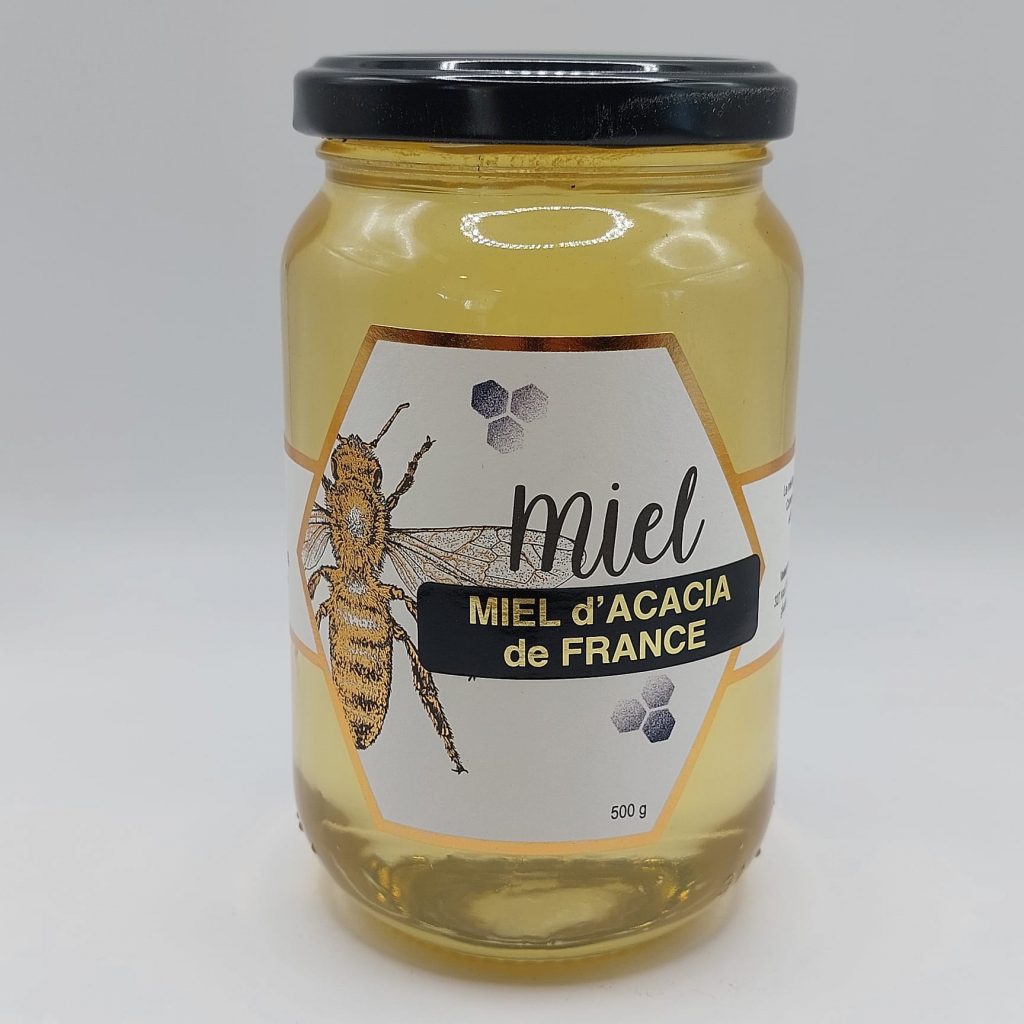 Pot de miel d’acacia au goût doux et aux notes florales légères.
